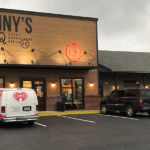 exterior storefront with cars