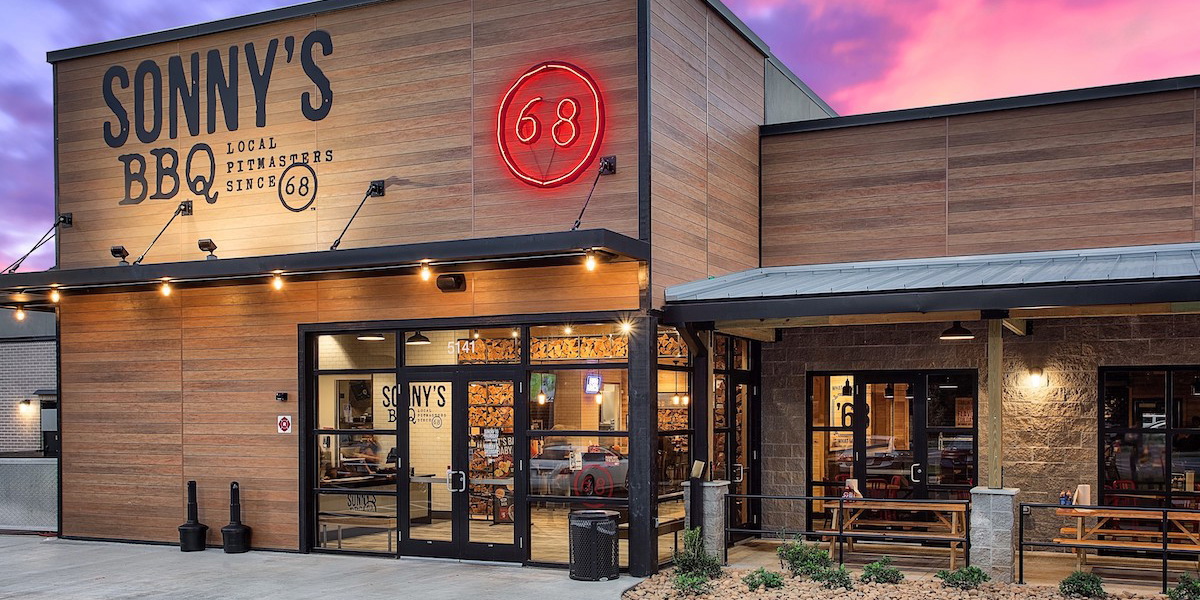 exterior storefront with neon 68 sign